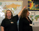 Michelle (with Abby's mom) pointing at our dear departed planet. Michelle (with Abby's mom) pointing at our dear departed planet.